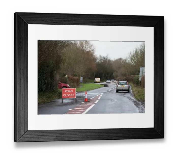Framed Print : Closed road with an abandoned vehicle at roadside and vehicles driving through floodwater, Hereford Road, south of Leominster, River Arrow flood plain, Herefordshire, England, UK Framed Print : Closed road with an abandoned vehicle at roadside and vehicles driving through floodwater, Hereford Road, south of Leominster, River Arrow flood plain, Herefordshire, England, UK