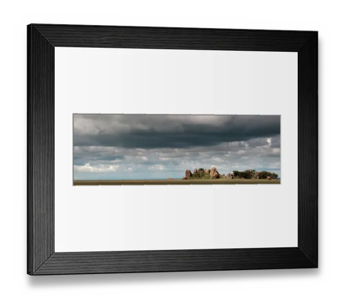 Framed Print : Heat haze over the savannah under dark clouds, Tanzania. March, 2010 Framed Print : Heat haze over the savannah under dark clouds, Tanzania. March, 2010