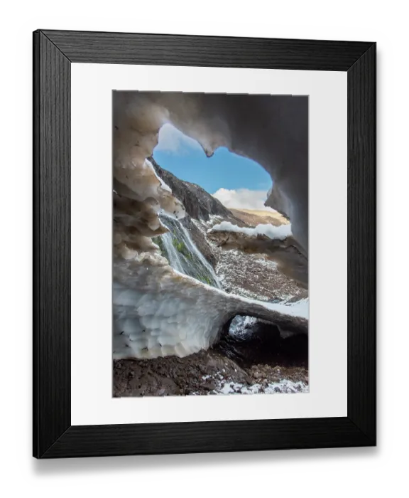 Framed Print : Ice tunnel adjacent to a waterfall above the treeline in Los Alerces National Park, UNESCO World Heritage Site, Patagonia, Argentina. March, 2024