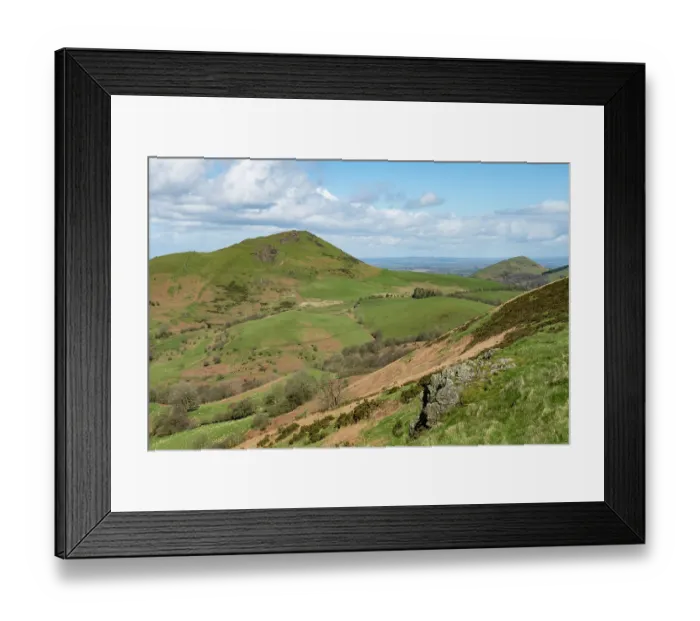 Framed Print : Caer Caradoc Hill and The Lawley composed of volcanic rock from the Precambrian Period viewed from Hope Bowdler Hill, Shropshire Hills National Landscape, England, UK. March, 2024