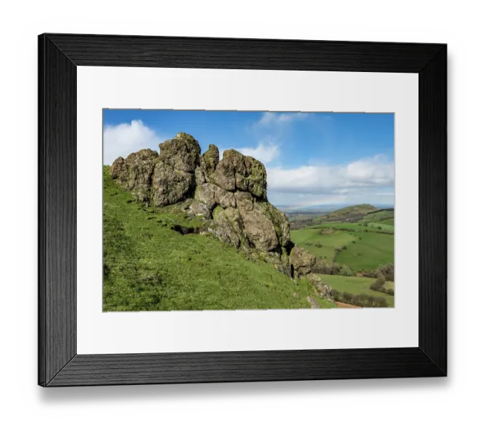 Framed Print : The Battle Stones, a crag composed of volcanic rock formed during the Cadomian Orgeny of the Precambrian period, approximately 600 million years ago, and The Lawley Framed Print : The Battle Stones, a crag composed of volcanic rock formed during the Cadomian Orgeny of the Precambrian period, approximately 600 million years ago, and The Lawley