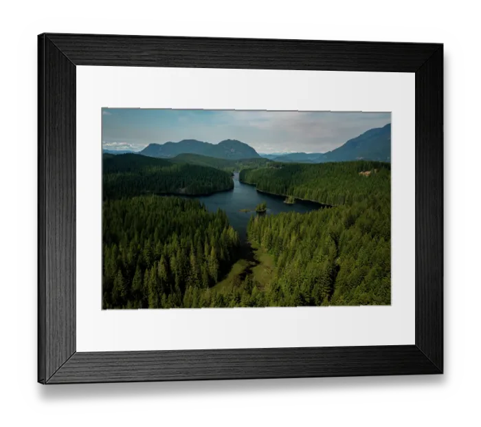 Framed Print : Aerial view of Cedar Lake surrounded by forest with mountains in background, Vancouver Island, British Columbia, Canada. May, 2023 Framed Print : Aerial view of Cedar Lake surrounded by forest with mountains in background, Vancouver Island, British Columbia, Canada. May, 2023