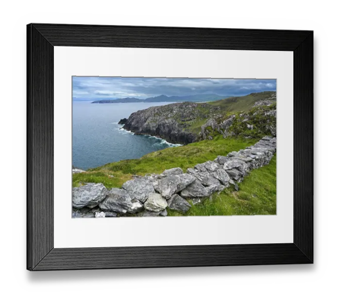 Framed Print : Dry stone wall along cliff top with view along the coast of the Beara Peninsula, County Cork, Republic of Ireland. June, 2022 Framed Print : Dry stone wall along cliff top with view along the coast of the Beara Peninsula, County Cork, Republic of Ireland. June, 2022