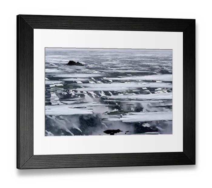 Framed Print : Mountain walls reflecting on a lake during thaw, Sognefjellet massif, Breiheimen National Park, Inland, Norway. June, 2024