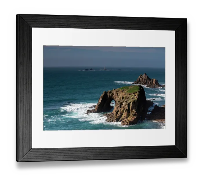 Framed Print : Ynys Dodman Natural Arch, within a granite sea stack, near Lands End, Cornwall, England, UK. February, 2024 Framed Print : Ynys Dodman Natural Arch, within a granite sea stack, near Lands End, Cornwall, England, UK. February, 2024
