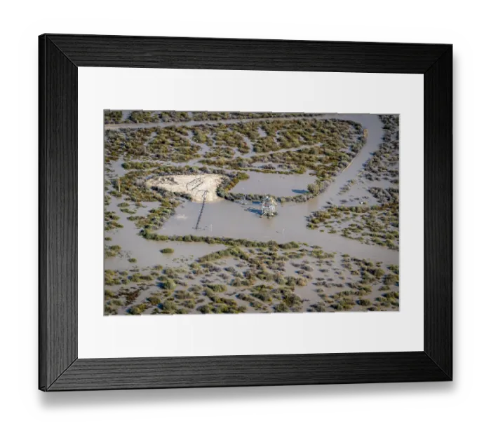 Framed Print : Aerial view over flooded mining infrastructure in the Lake Eyre basin,  Tirrawarra Swamp, Gidgealpa, South Australia, Australia. July, 2022