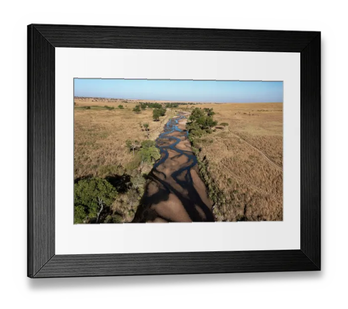 Framed Print : Aerial view of the plains and the Sand river, Masai-Mara game reserve, Kenya. August, 2023
