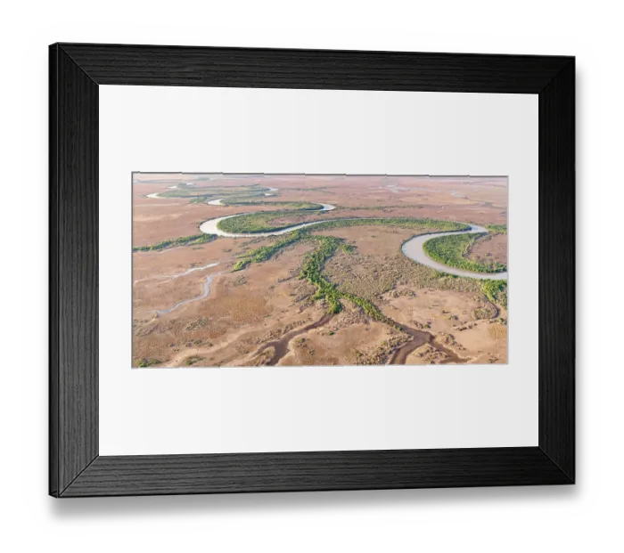 Framed Print : Aerial view of the famouss bends of the lower Adelaide River flowing through seasonal floodplains in the late dry season, Northern Territory, Australia. October, 2024 Framed Print : Aerial view of the famouss bends of the lower Adelaide River flowing through seasonal floodplains in the late dry season, Northern Territory, Australia. October, 2024