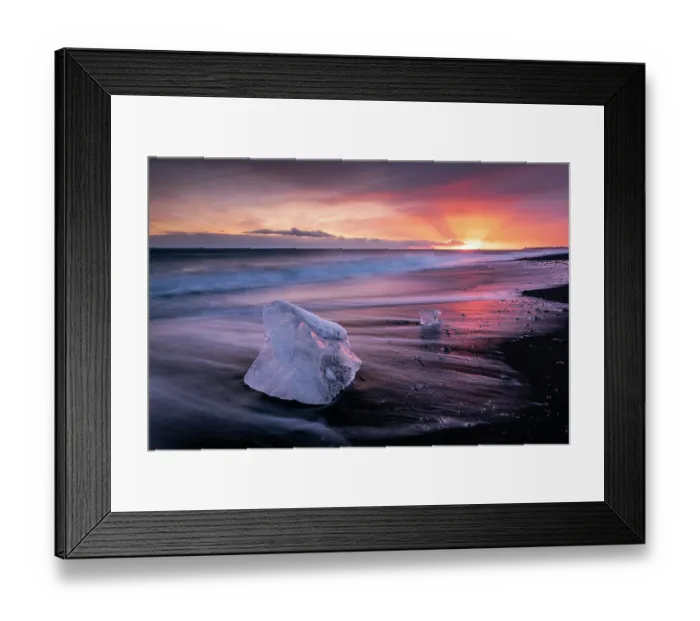 Framed Print : RF - Diamond Beach at sunset, block of ice on a strip of black sand belonging to the greater Breioamerkursandur glacial plain, Jokulsarlon glacier lagoon, south coast of Iceland Framed Print : RF - Diamond Beach at sunset, block of ice on a strip of black sand belonging to the greater Breioamerkursandur glacial plain, Jokulsarlon glacier lagoon, south coast of Iceland