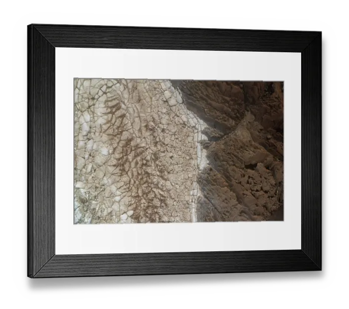 Framed Print : Aerial view of dirty sea ice next to the rocky shoreline, Hudson Bay, Manitoba, Canada. June, 2024 Framed Print : Aerial view of dirty sea ice next to the rocky shoreline, Hudson Bay, Manitoba, Canada. June, 2024