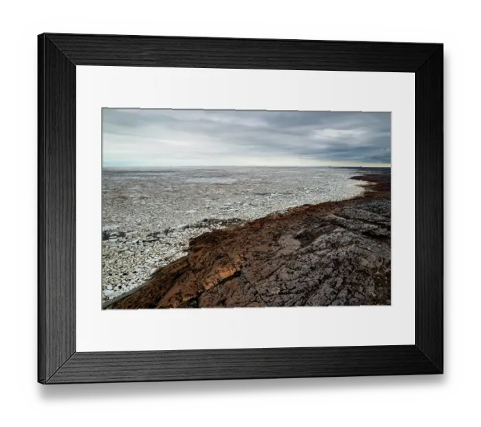 Framed Print : Aerial view of the rocky shoreline of the Hudson Bay with sea ice starting to break up as spring warms the land and sea, near Churchill, Manitoba, Canada. June, 2024 Framed Print : Aerial view of the rocky shoreline of the Hudson Bay with sea ice starting to break up as spring warms the land and sea, near Churchill, Manitoba, Canada. June, 2024