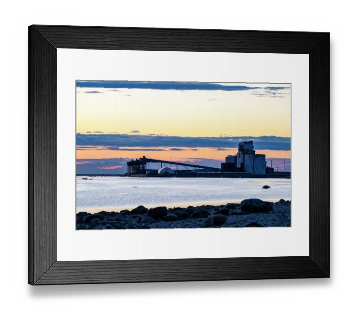Framed Print : The port of Churchill backlit at sunset viewed from the shores of the Churchill River, Manitoba, Canada. June, 2024 Framed Print : The port of Churchill backlit at sunset viewed from the shores of the Churchill River, Manitoba, Canada. June, 2024