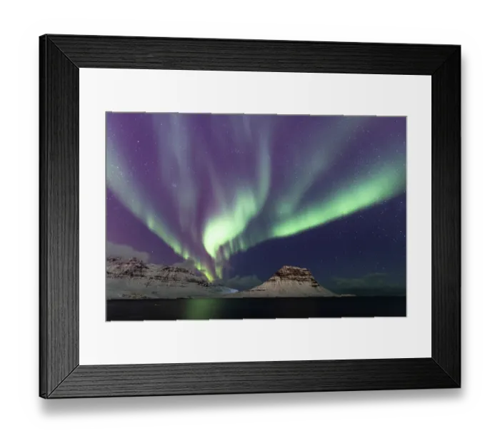 Framed Print : Aurora borealis lighting up the night sky over snow-covered mountains, Kirkjufell, Snaefellsnes peninsula, Iceland. February, 2023 Framed Print : Aurora borealis lighting up the night sky over snow-covered mountains, Kirkjufell, Snaefellsnes peninsula, Iceland. February, 2023