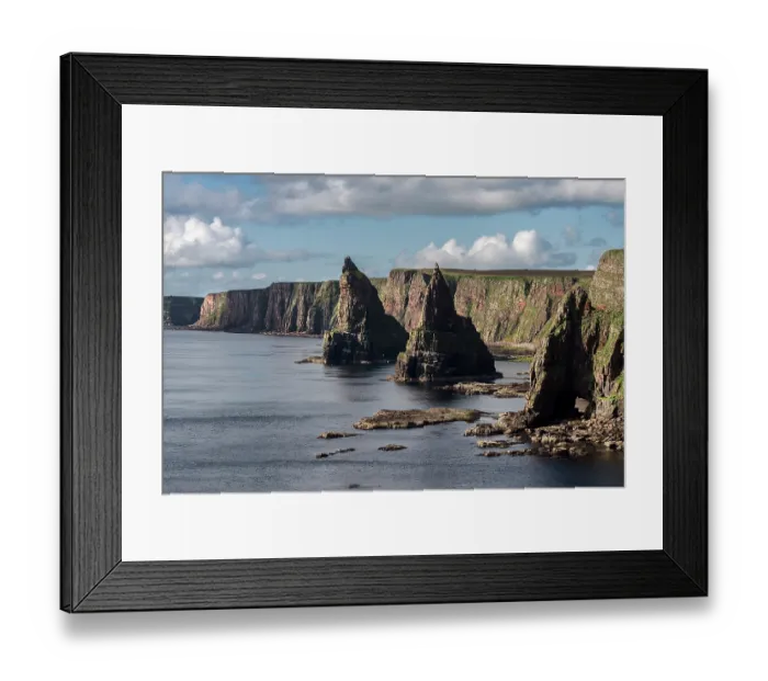 Framed Print : Sheer cliffs and sea stacks at Duncansby Head, Caithness, northern Scotland, UK. July, 2017 Framed Print : Sheer cliffs and sea stacks at Duncansby Head, Caithness, northern Scotland, UK. July, 2017
