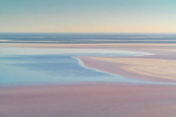 Aerial view of blue and pink water of Lake Eyre Water, the result of high levels of desert rainfall, Lake Eyre North, South Australia, March, 2022