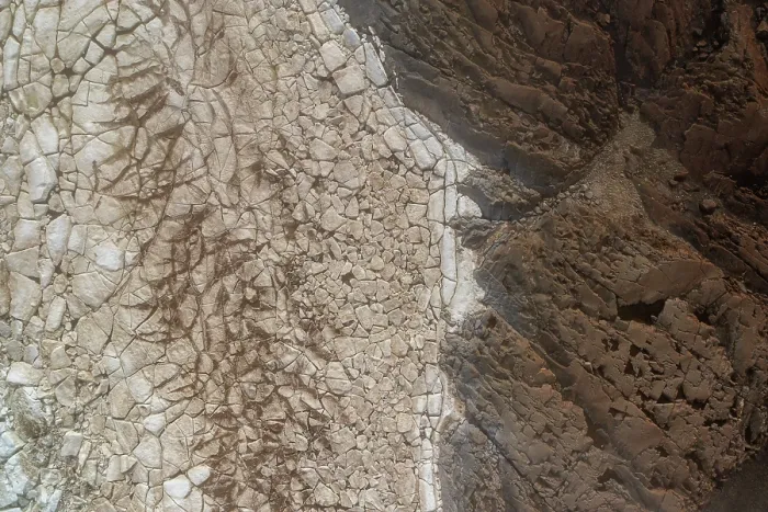Framed Print : Aerial view of dirty sea ice next to the rocky shoreline, Hudson Bay, Manitoba, Canada. June, 2024 Framed Print : Aerial view of dirty sea ice next to the rocky shoreline, Hudson Bay, Manitoba, Canada. June, 2024