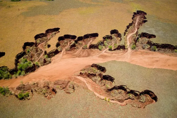 Framed Print : Aerial view of eroded banks and river with suspended load, caused by deforestation Framed Print : Aerial view of eroded banks and river with suspended load, caused by deforestation