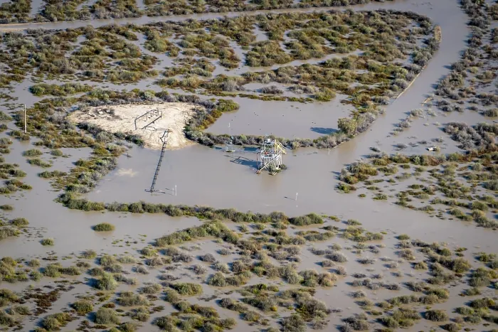 Framed Print : Aerial view over flooded mining infrastructure in the Lake Eyre basin,  Tirrawarra Swamp, Gidgealpa, South Australia, Australia. July, 2022