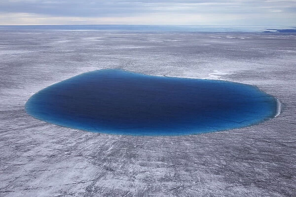 Aerial view of meltwater lake on the ice cap north-east of Sermeq Kujalleq Glacier