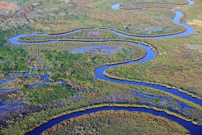 Framed Print : Aerial view of the Okavango Delta with meandering channels, lagoons, swamps and islands, Botswana, Africa Framed Print : Aerial view of the Okavango Delta with meandering channels, lagoons, swamps and islands, Botswana, Africa