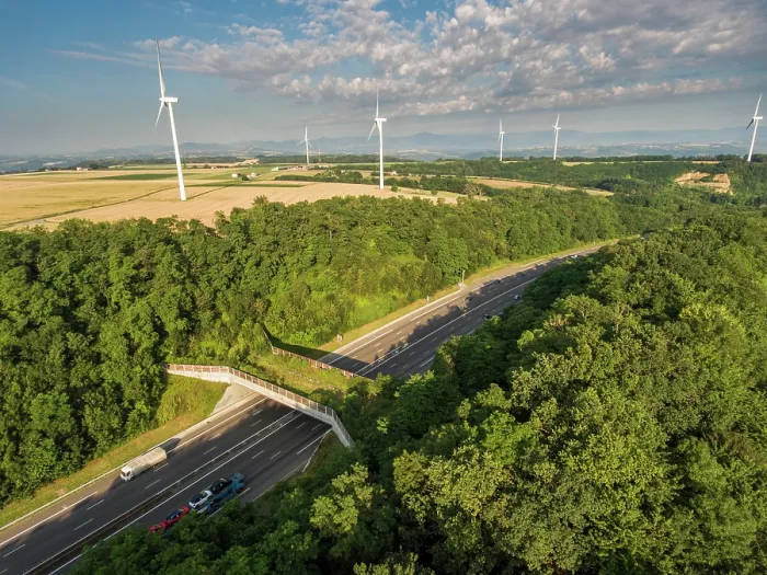 Framed Print : Aerial view of a wildlife crossing over the A7 highway, built in 2011, with wind turbines in distance, Drome, France. June, 2018 Framed Print : Aerial view of a wildlife crossing over the A7 highway, built in 2011, with wind turbines in distance, Drome, France. June, 2018