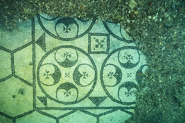 Ancient Roman tessellatum mosaic in black and white decorated with pattern of hexagons, perfectly preserved, in Villa a Protiro. Marine Protected Area of Baia, Naples, Italy. Tyrrhenian sea