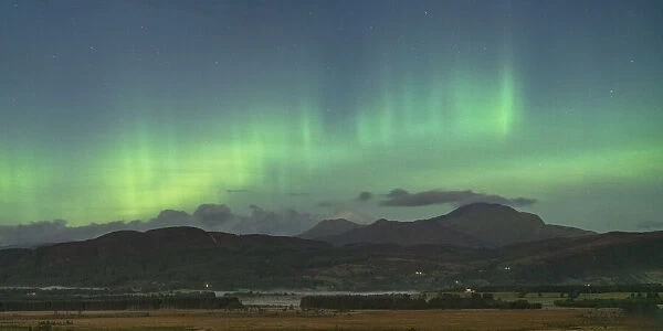Aurora borealis in the evening sky over Ben Ledi from Buchlyvie, The Trossachs National Park, Stirling, Scotland. September, 2020
