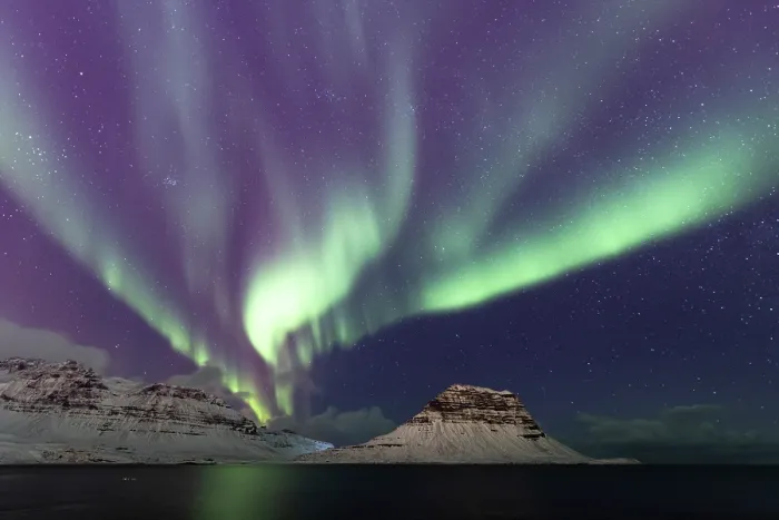 Framed Print : Aurora borealis lighting up the night sky over snow-covered mountains, Kirkjufell, Snaefellsnes peninsula, Iceland. February, 2023 Framed Print : Aurora borealis lighting up the night sky over snow-covered mountains, Kirkjufell, Snaefellsnes peninsula, Iceland. February, 2023