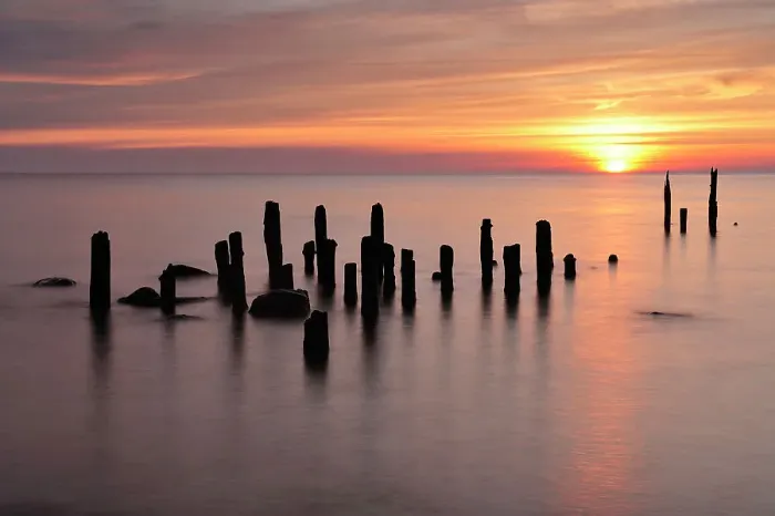 Framed Print : Baltic sea with posts sticking out of water at sunset, Latvia, June 2009 Framed Print : Baltic sea with posts sticking out of water at sunset, Latvia, June 2009