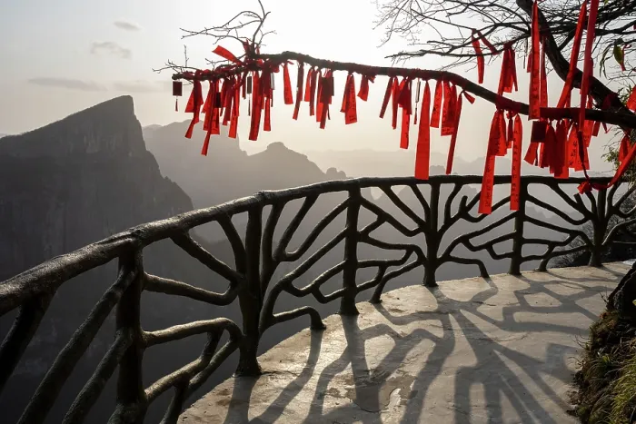 Framed Print : Buddhist prayer flags tied to tree branches, to bring good luck, Tianmen Mountain National Park, Zhangjiajie, Hunan, China. March, 2024 Framed Print : Buddhist prayer flags tied to tree branches, to bring good luck, Tianmen Mountain National Park, Zhangjiajie, Hunan, China. March, 2024