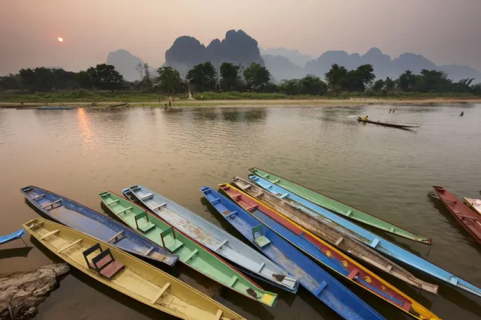 Framed Print : Canoes on the moored on the Nam Song River at Vang Vieng, Laos, March 2009 Framed Print : Canoes on the moored on the Nam Song River at Vang Vieng, Laos, March 2009