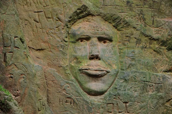 Framed Print : Carving of human face in sandstone wall of Shutes Lane holloway, Symondsbury, Dorset, England, UK, December 2023 Framed Print : Carving of human face in sandstone wall of Shutes Lane holloway, Symondsbury, Dorset, England, UK, December 2023