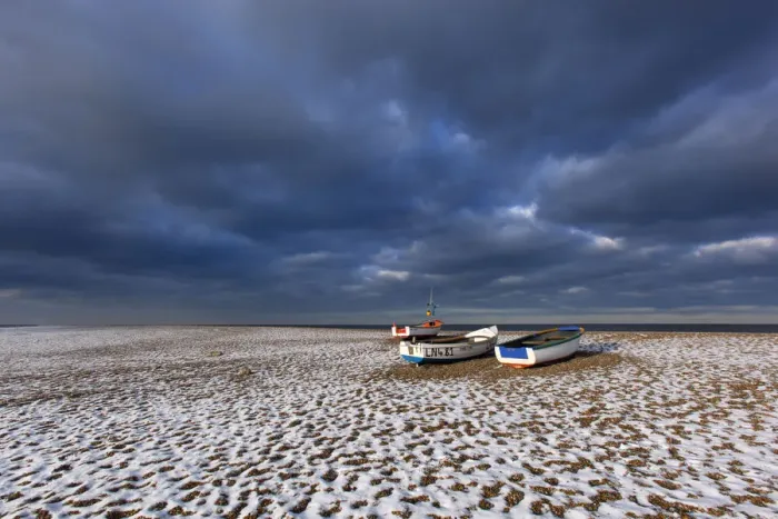 Framed Print : Cley Beach with scattering of light snow, and boats, Norfolk, England, UK, December 2010 Framed Print : Cley Beach with scattering of light snow, and boats, Norfolk, England, UK, December 2010