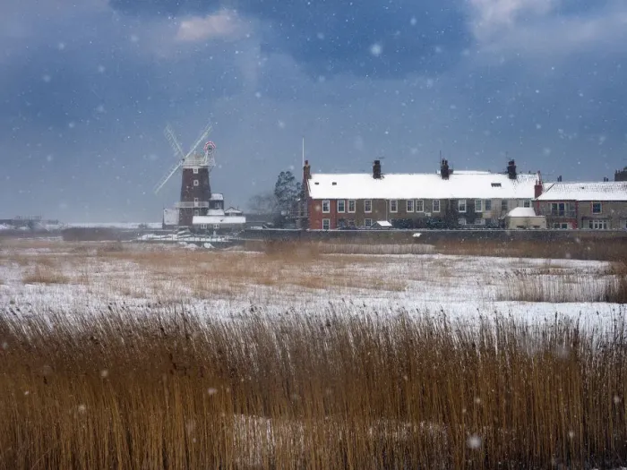 Framed Print : Cley Mill and Reedbed in winter snow storm, Norfolk, UK, February Framed Print : Cley Mill and Reedbed in winter snow storm, Norfolk, UK, February