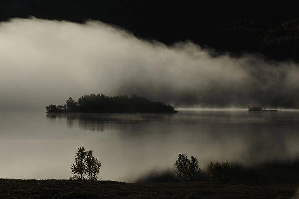 Clouds over lake, Forollhogna National Park, Norway, September 2008