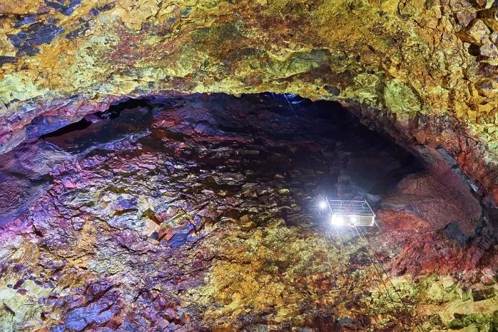 Framed Print : Colourful rocks inside the magma chamber of Thrihnukagigur volcano with torch light from an open cable lift Framed Print : Colourful rocks inside the magma chamber of Thrihnukagigur volcano with torch light from an open cable lift