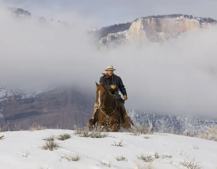 Framed Print : Cowboy riding over hill in snow, Sombrero Ranch, Craig, Colorado, USA Model released Framed Print : Cowboy riding over hill in snow, Sombrero Ranch, Craig, Colorado, USA Model released