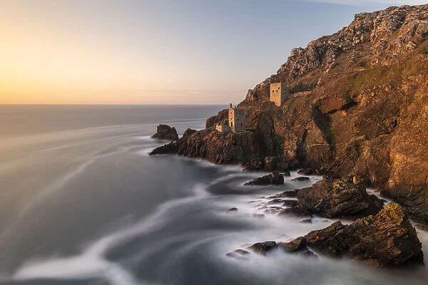 The Crowns Engine houses bathed in late evening light, Botallack, West Cornwall, UK