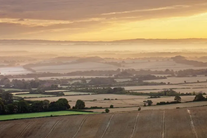 Framed Print : Dawn mist and rolling chalk downland viewed from Wilmington Hill, Wilmington, South
