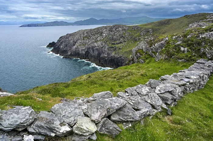 Framed Print : Dry stone wall along cliff top with view along the coast of the Beara Peninsula, County Cork, Republic of Ireland. June, 2022 Framed Print : Dry stone wall along cliff top with view along the coast of the Beara Peninsula, County Cork, Republic of Ireland. June, 2022