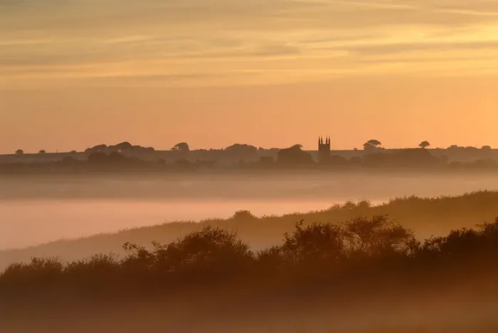 Framed Print : Early morning mist, looking toward Bradworthy village and church, Devon, UK Framed Print : Early morning mist, looking toward Bradworthy village and church, Devon, UK