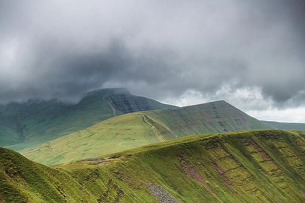 Fan y Big, Cribyn and Pen y Fan viewed from the south east, with storm clouds approaching. These are three glacial cwm's, corries  /  cirques carved into the Devonian, Old Red Sandstone escarpment, Brecon Beacons National Park, Wales, UK