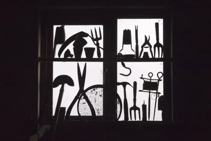 Framed Print : Garden tools silhouetted in potting shed window. September, UK Framed Print : Garden tools silhouetted in potting shed window. September, UK