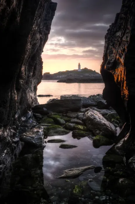 Framed Print : Godrevy Lighthouse at sunset, seen through rocksand rockpool in the foreground. Nr Hayle Framed Print : Godrevy Lighthouse at sunset, seen through rocksand rockpool in the foreground. Nr Hayle