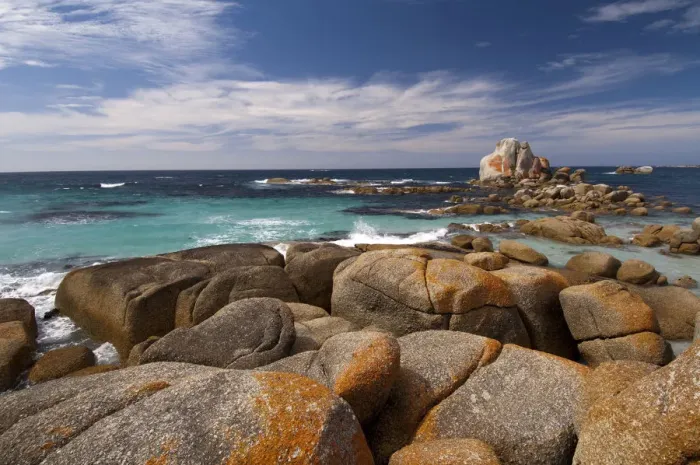 Framed Print : Headland coastline clad in granite boulders covered in red lichen, Mount William National Park Framed Print : Headland coastline clad in granite boulders covered in red lichen, Mount William National Park