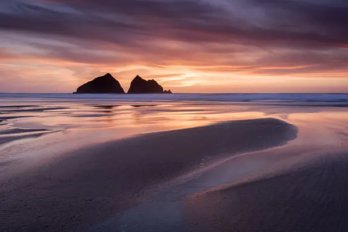 Framed Print : Holywell Bay at sunset, at low tide with Carters Rocks reflected in water Framed Print : Holywell Bay at sunset, at low tide with Carters Rocks reflected in water