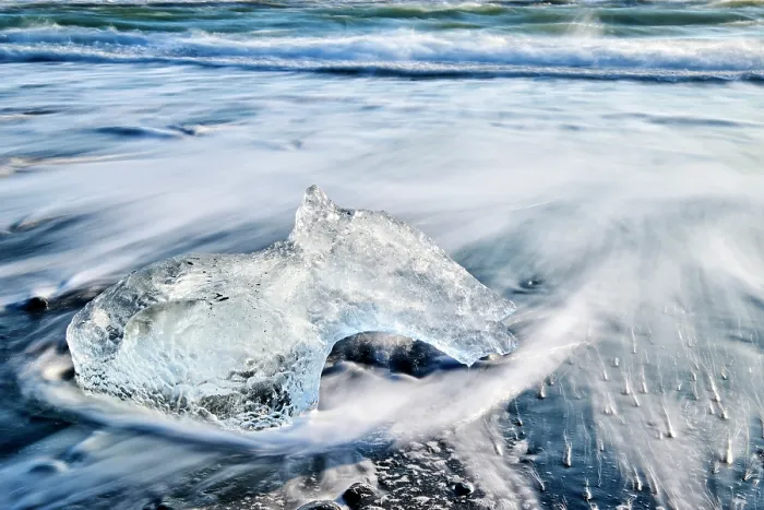 Framed Print : Ice on black, volcanic sand beach with waves on glacial lake, Diamond beach, Jokulsarlon, Vatnajokull National Park, Iceland. September, 2023