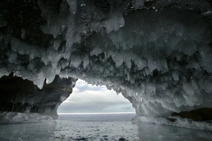 Framed Print : Ice hanging from arch in sea cave carved in soft sandstone cliffs, frozen lake, Squaw Bay Framed Print : Ice hanging from arch in sea cave carved in soft sandstone cliffs, frozen lake, Squaw Bay