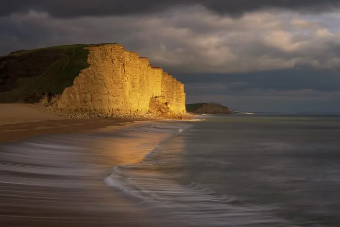 Framed Print : Late evening light bathing sandstone cliffs at West Bay, Jurassic Coast World Heritage Site, Dorset, England, UK. February, 2023 Framed Print : Late evening light bathing sandstone cliffs at West Bay, Jurassic Coast World Heritage Site, Dorset, England, UK. February, 2023