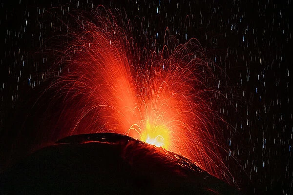 Lava erupting from Reventador volcano at night, El Chaco, Napo, Ecuador. October, 2020